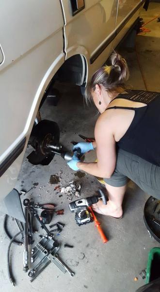 My awesome wife helping out with the suspension and brakes.